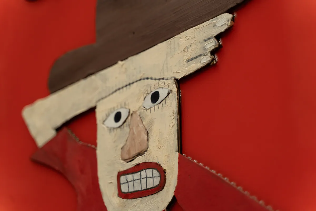 Detail of the cowboy’s face and hat