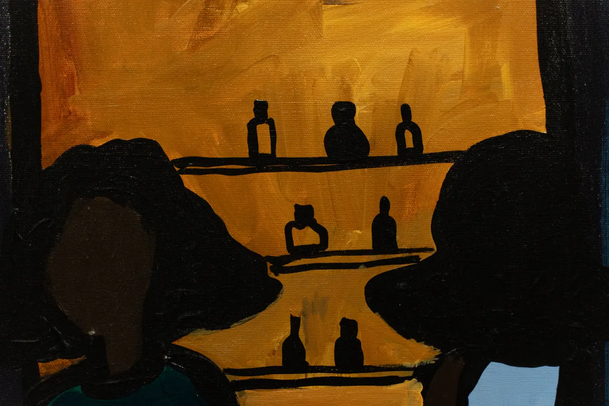 Detail of bottles on the shelf against the amber ground